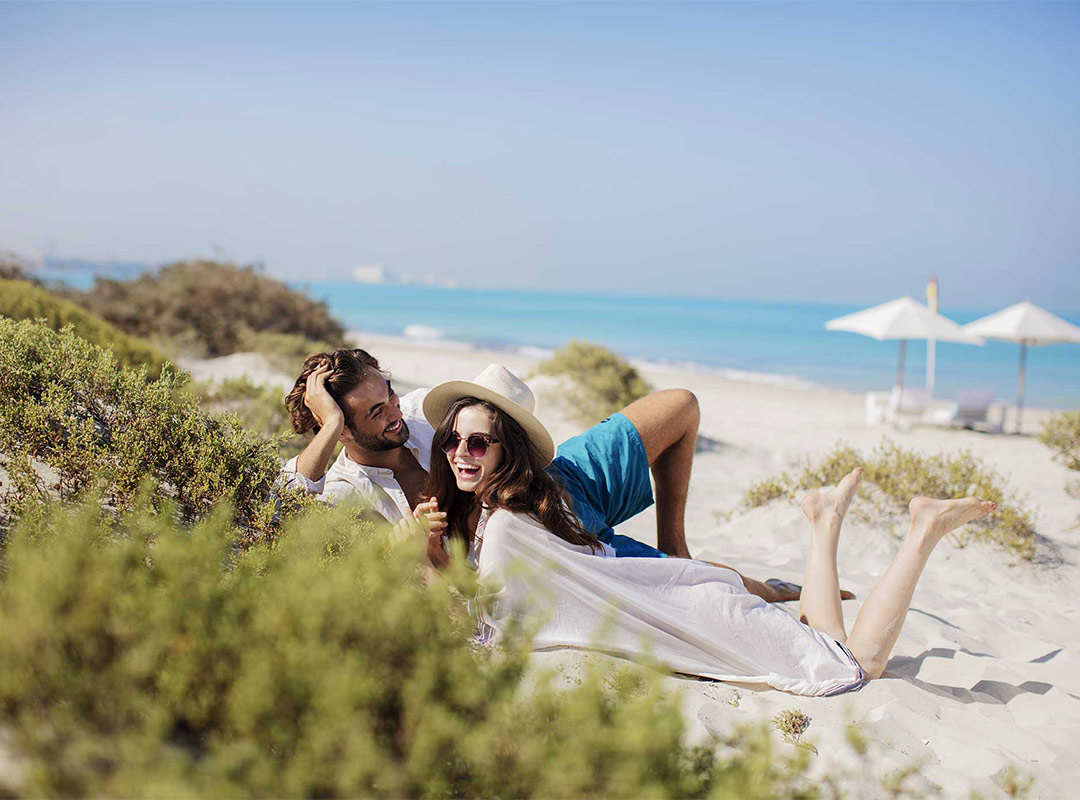 Couple on Saadiyat Island beach