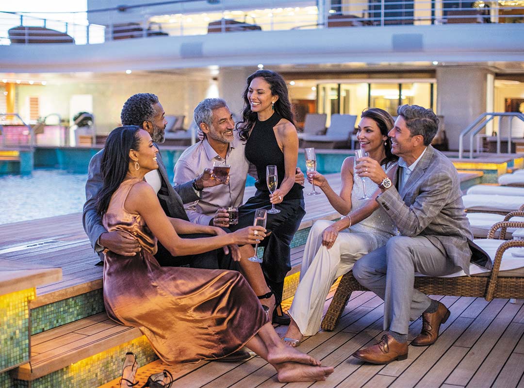 Friends with drinks on cruise ship