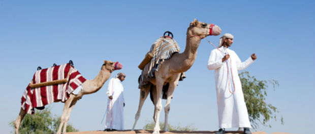 Taking a camel ride at Banyan Tree Al Wadi