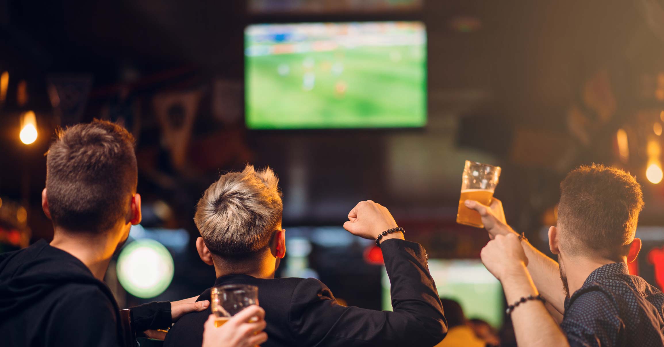 Friends watching football