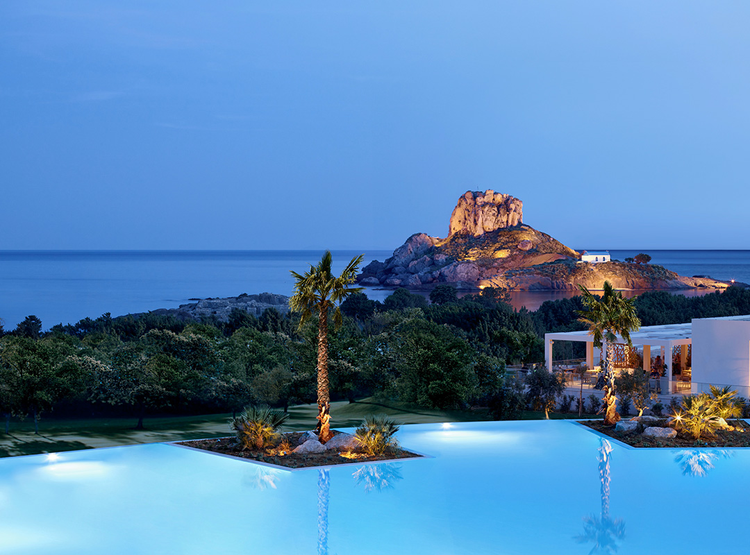 Ikos Aria pool in the evening