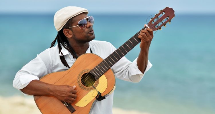 Caribbean man playing guitar