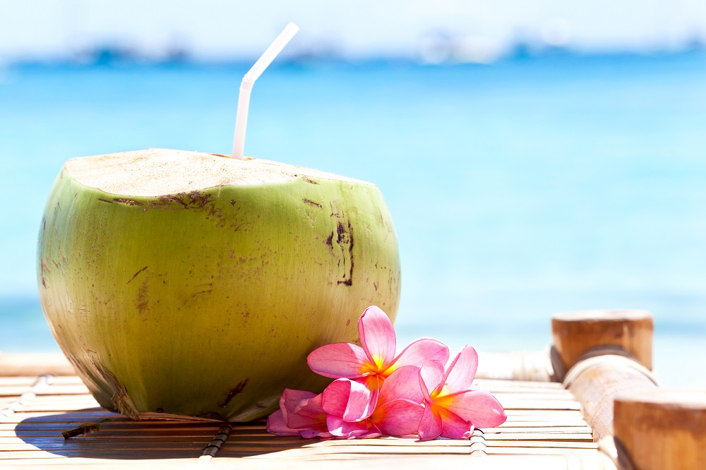 Coconut cocktail on beach