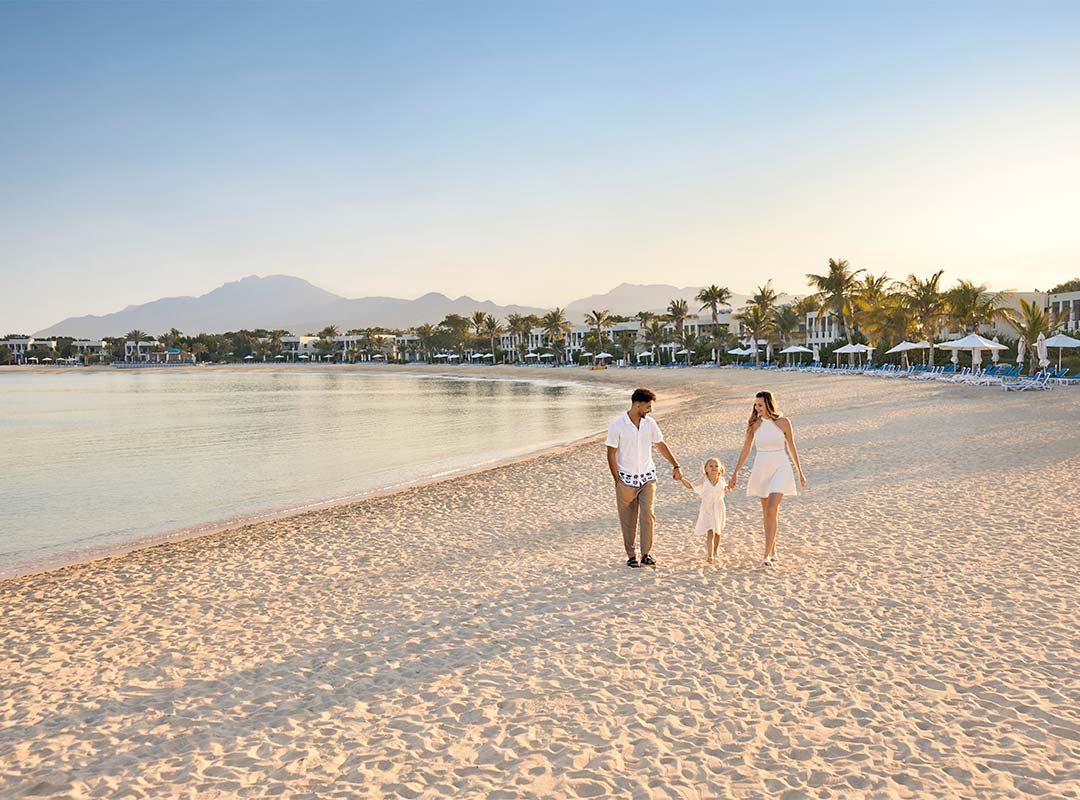 Family on the beach in Ras Al Khaimah