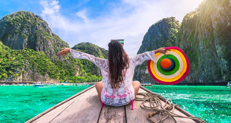 Girl on a longboat in Thailand