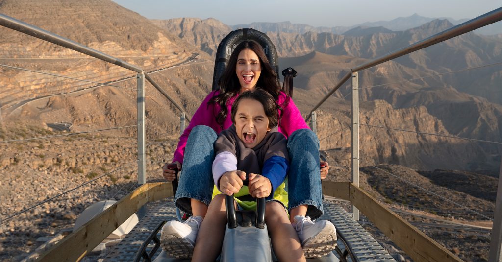 Family enjoying a ride on the Jais Sledder