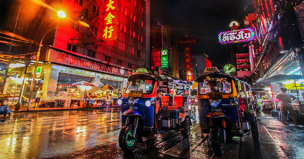 Tuk tuks on a Bangkok street at night time