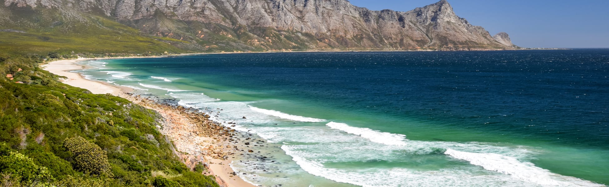 stunning-view-of-kogel-bay-beach-located-along-route-44-in-the-eastern-part-of-false-bay-near-cape-town-between-gordons-bay-and-pringle-bay-hottentots-holland-mountain-range-in-the-background.jpg