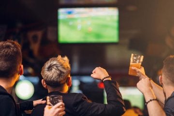 Friends watching football
