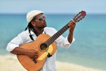 Caribbean man playing guitar