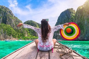 Girl on a longboat in Thailand
