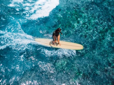 Surfing at Mount Irvine Bay