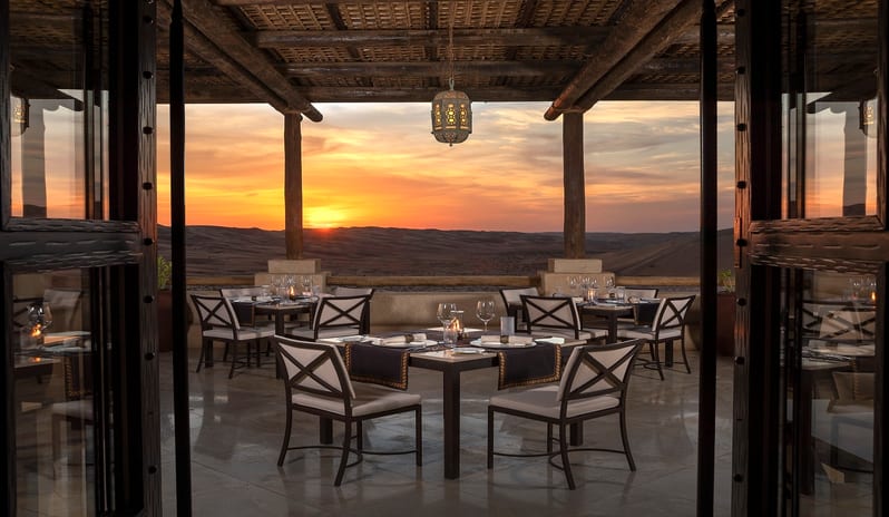 qasr_al_sarab_desert_resort_by_anantara_restaurants_suhail_outdoor_terrace_sunset