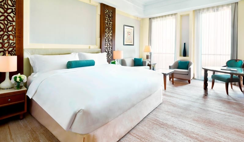 Al-Bustan-Ritz-Carlton-Hotel-Deluxe-King-Mountain-View-Room-Bed