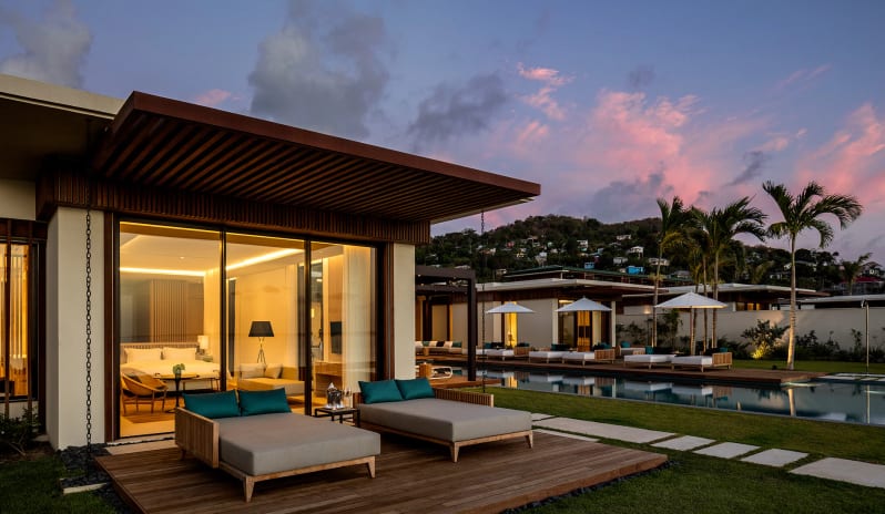 12_-beachfront-villa-main-master-bedroom-terrace-at-dusk-65552c63acf43