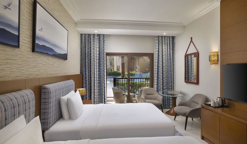middle-east-holidays-ras-al-khaimah-doubletree-by-hilton-resort-spa-marjan-island-hotel-guest-room-with-pool-view