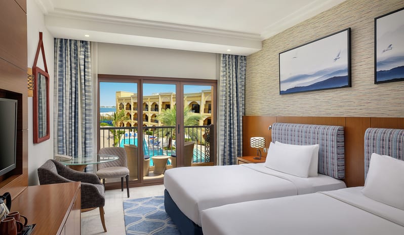 middle-east-holidays-ras-al-khaimah-doubletree-by-hilton-resort-spa-marjan-island-hotel-guest-room-with-pool-view