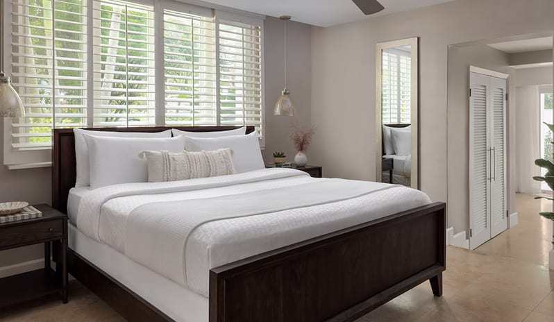 Bedroom at Sandals Royal Bahamian hotel in Caribbean by Kenwood Travel