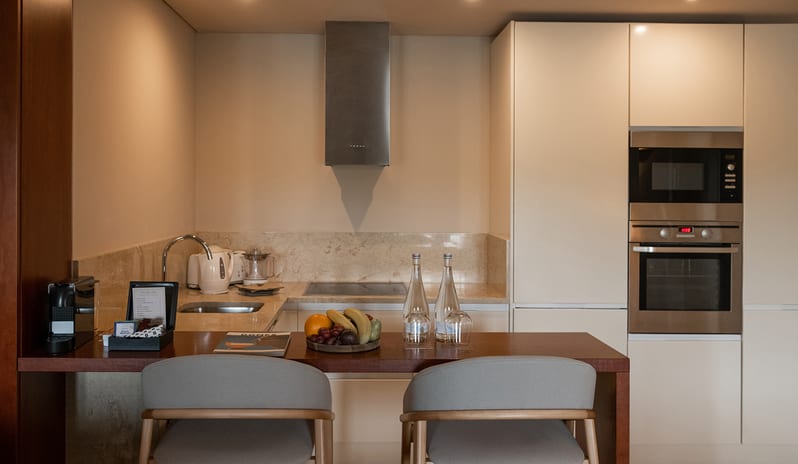 Elite Sapphire Two Bedroom Residence Full kitchen facilities, marble finishes, microwave, and integrated oven at Domes Lake Algarve by Kenwood Travel