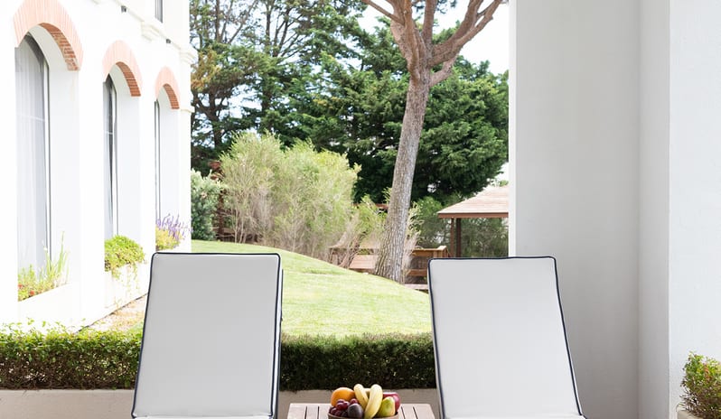 Domes Lake Algarve - Elite Tropical One Bedroom Residence Arched architectural terrace, private wooden decking, and dual sunbeds-Kenwood Travel