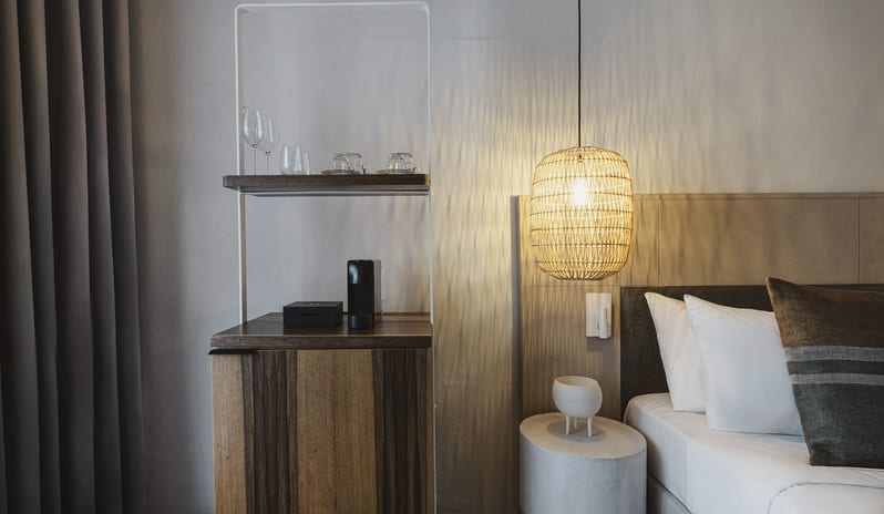 Sapphire Cozy Nest Stylish Bedroom Interior with Modern Amenities at Domes Aulūs Elounda by Kenwood Travel