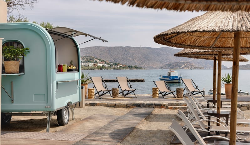 Ammos | Beach Canteen Seaside Food Truck with Relaxing Beach Lounge at Domes Aulūs Elounda by Kenwood Travel