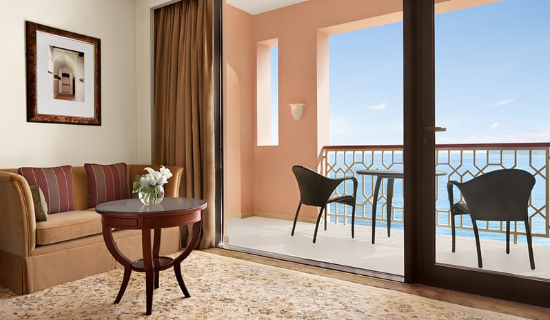 Living Space With Balcony View at Al Husn Hotel in Middle East Holiday by Kenwood Travel