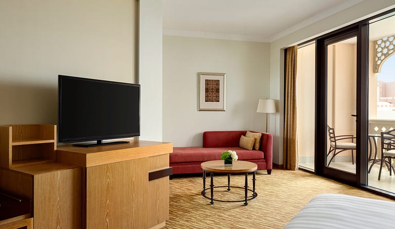 Bedroom With Living Space at Hilton Muscat Al Bandar Hotel in Middle East Holiday by Kenwood Travel