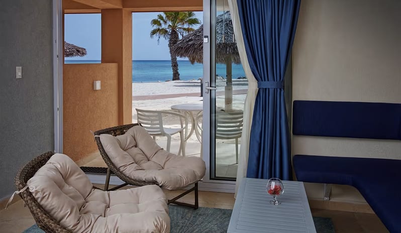 Living Space With Sea Front View at Tamarijn Aruba All Inclusive Resor in Caribbean Holiday by Kenwood Travel