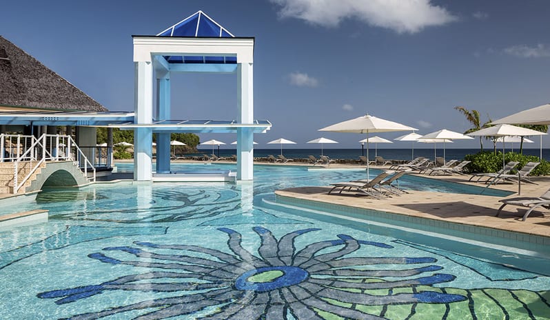 Pool at Sandals Regency La Toc hotel in Caribbean by Kenwood Travel