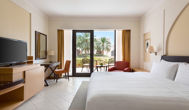 Guest Room with Terrace Luxury guest room with terrace, garden view, and flat-screen TV at Hilton Muscat Al Bandar at Hilton Muscat Al Bandar by Kenwood Travel