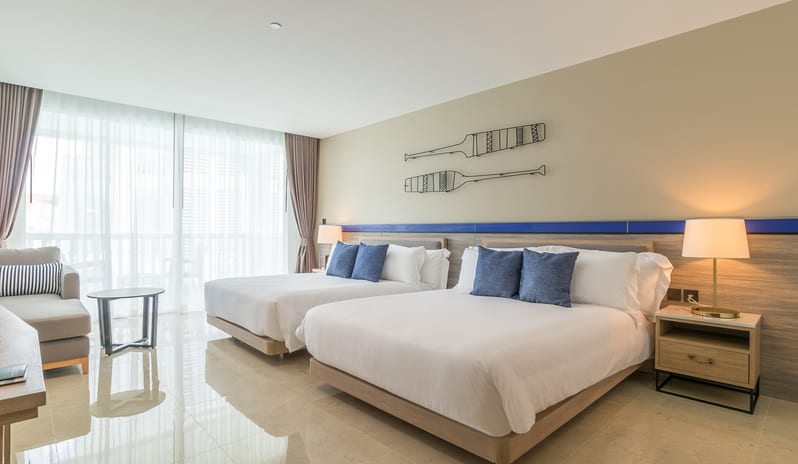 Premium Deluxe Pool Terrace Room with two queen beds, nautical-themed wall decor, and a private balcony at Centara Ao Nang Beach Resort & Spa Krabi by Kenwood Travel