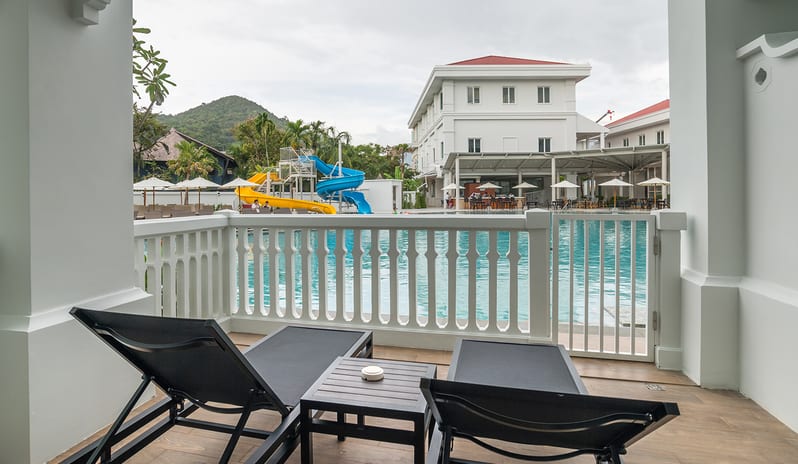 Family Residence Luxury pool access hotel room terrace featuring outdoor loungers, safety gate, and a view of the resort water park and tropical hills at Centara Ao Nang Beach Resort & Spa Krabi by Kenwood Travel
