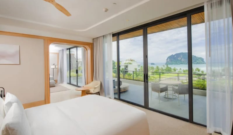 Wellness Lagoon Pool Villa spacious living area, grey sectional sofa, kid's teepee play tent, and elegant dining space at Anantara Koh Yao Yai Resort & Villas by Kenwood Travel