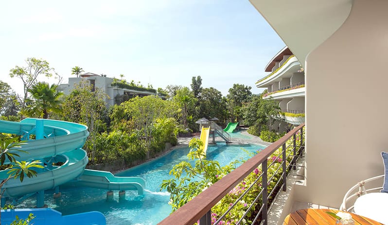 Family Pool View Suite family pool area featuring turquoise water slides and lush tropical landscaping at Anantara Koh Yao Yai Resort & Villas by Kenwood Travel