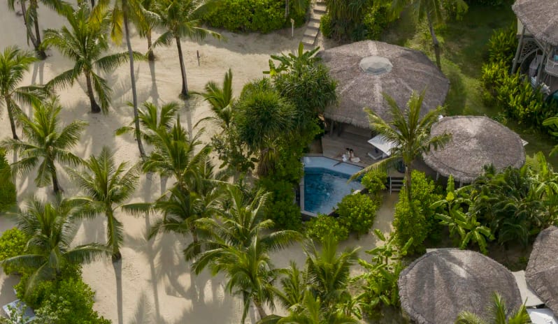 Aerial View of Luxury Beachfront Treehouse Villas with Thatched Roofs at TreeHouse Villas Koh Yao by Kenwood Travel