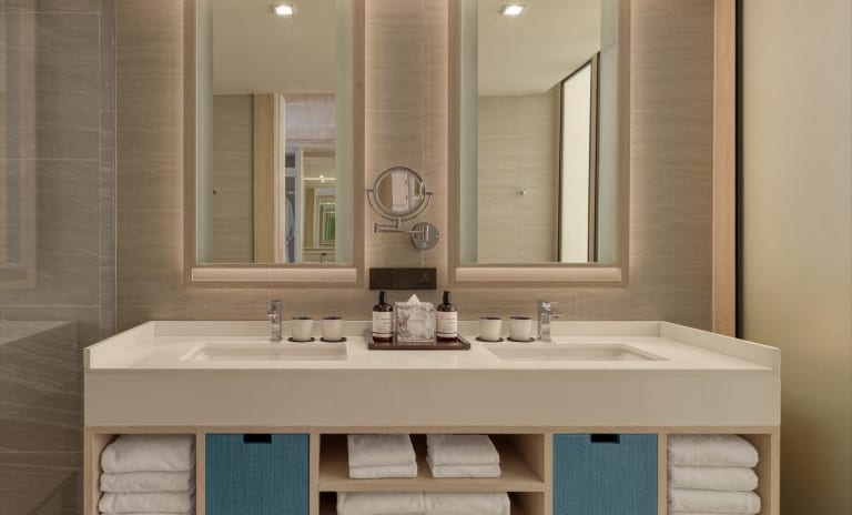 Deluxe Premium Bathroom Vanity Set with Premium Toiletries, Marble Accents, and Plush Towels at Dusit Thani Krabi Beach Resort by Kenwood Travel