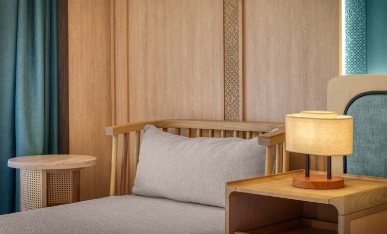 Deluxe Premium Contemporary Bedroom Design Featuring Warm Ambient Lighting and Crisp White Linens at Dusit Thani Krabi Beach Resort by Kenwood Travel