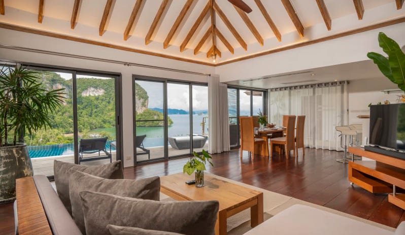 Hilltop Pool Villa Living Room with Open-Plan Interior, Wooden Ceiling, Ocean View, and Private Infinity Pool at TreeHouse Villas Koh Yao by Kenwood Travel