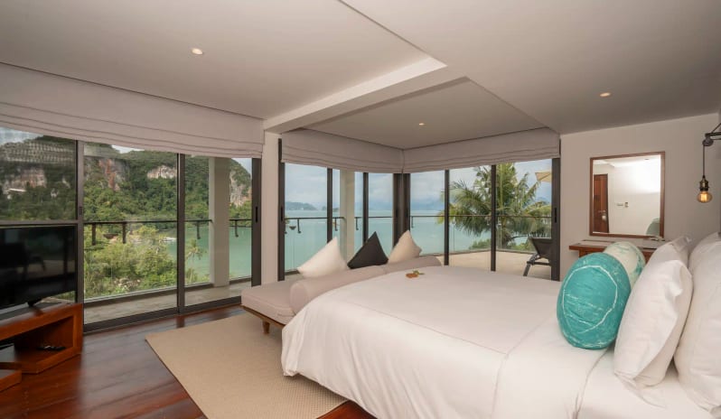 Hilltop Pool Villa Luxury Hilltop Bedroom with Panoramic Ocean View, Floor-to-Ceiling Glass Windows, and Modern Resort Interior at TreeHouse Villas Koh Yao by Kenwood Travel