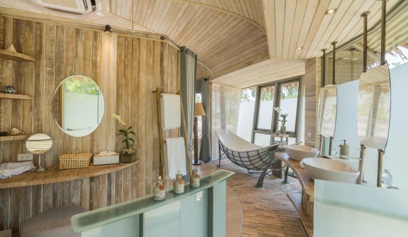 Rustic chic bathroom interior with hammock tub and wood slat vaulted ceiling at TreeHouse Villas Koh Yao by Kenwood Travel