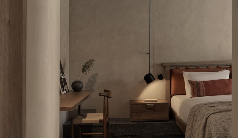 Tropical Retreat Suite with Warm Lighting, Earth-Toned Linens, and Rustic Wooden Textures at Aulūs Lindos Rhodes, Curio Collection by Hilton by Kenwood Travel