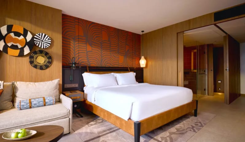 Premium Spa Explorer (King) Premium Spa Explorer room featuring king bed, seating area, and wooden interior finishes at Centara Grand Mirage Beah Resort by Kenwood Travel