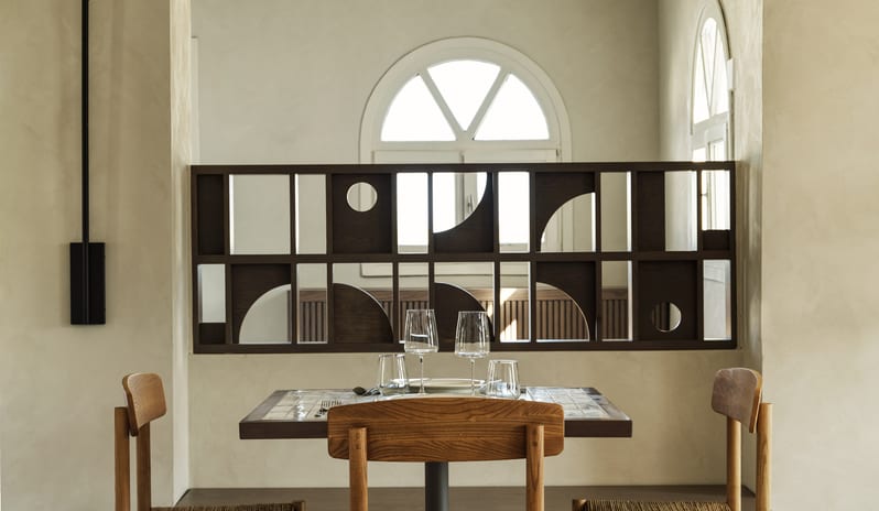 Meze Restaurant interior, modern Mediterranean decor, minimalist restaurant design. at Aulūs Lindos Rhodes, Curio Collection by Hilton by Kenwood Travel