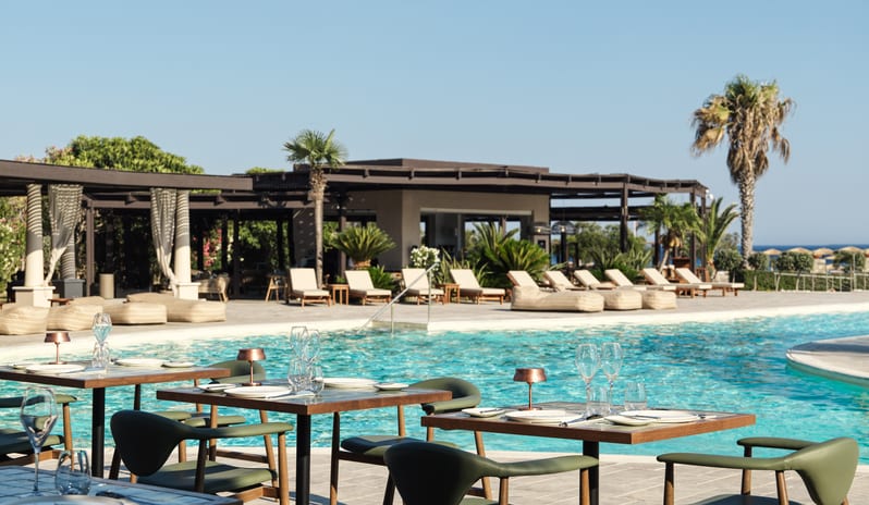Tesoro Mio Bar Restaurant Elegant outdoor dining area at Aulūs Lindos Rhodes, Curio Collection by Hilton by Kenwood Travel