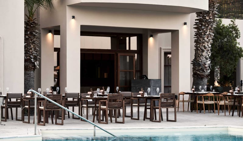 Tesoro Mio Bar Restaurant ElegantOutdoor poolside dining terrace at Aulūs Lindos Rhodes, Curio Collection by Hilton by Kenwood Travel