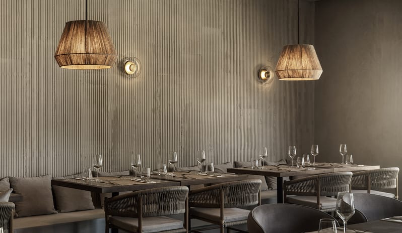 The Island Buffet Restaurant elegant wooden dining tables with cushioned seating at Aulūs Lindos Rhodes, Curio Collection by Hilton by Kenwood Travel