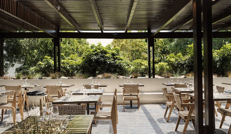 The Island Buffet Restaurant Shaded outdoor dining area at Aulūs Lindos Rhodes, Curio Collection by Hilton by Kenwood Travel