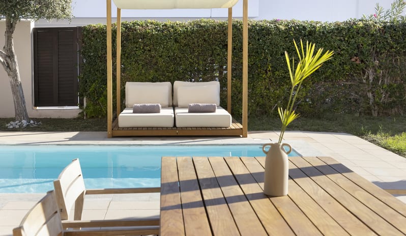 Tropical Bungalow Suite with Private Pool arthy cOutdoor patio of a tropical bungalow suite featuring a private turquoise pool at Aulūs Lindos Rhodes, Curio Collection by Hilton by Kenwood Travel