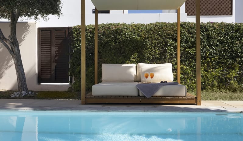 Tropical Bungalow Suite with Private Pool arthy cOutdoor patio of a tropical bungalow suite featuring a private turquoise pool at Aulūs Lindos Rhodes, Curio Collection by Hilton by Kenwood Travel